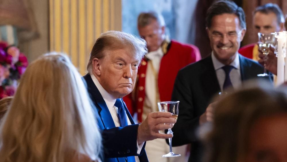 Trump calls for 'unqualified capitulation' from Iran as Putin holds talks with Iran's leader.